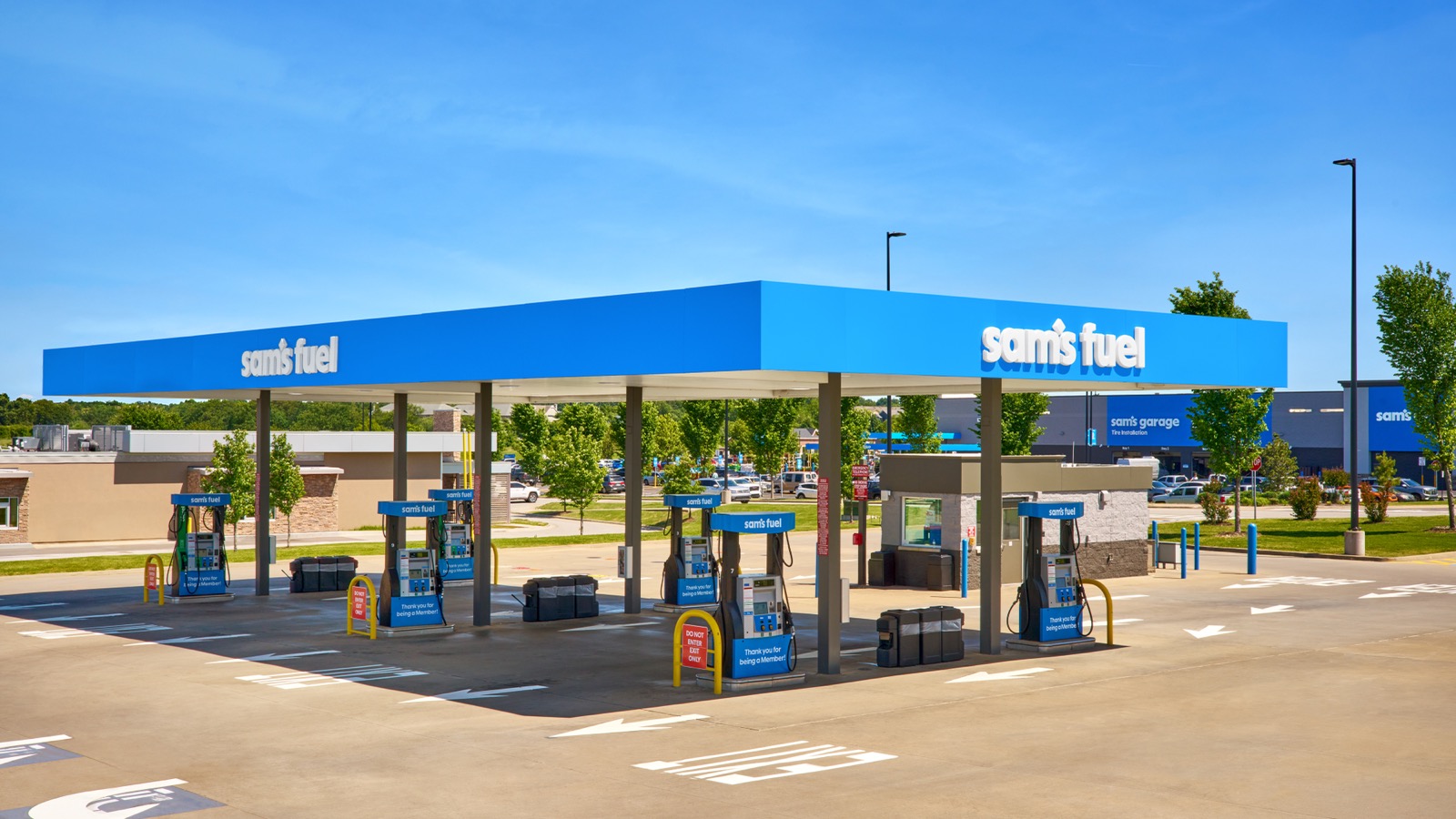 A Sam's Club fuel canopy in the new identity, with the sam's garage sign beyond.