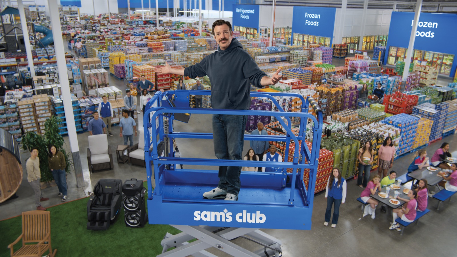 Jason Sudeikis standing inside a Sam's Club for the "Come Join Us" campaign.